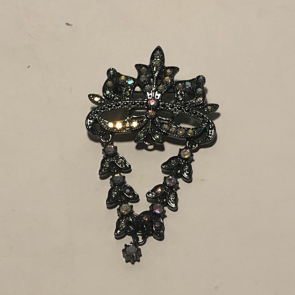Elegant Black and Silver Mask Brooch